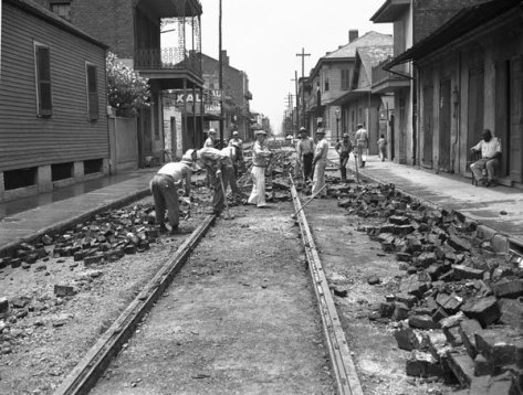 WPA removing car tracks on Burgundy Street near Dumaine Street, 1937.